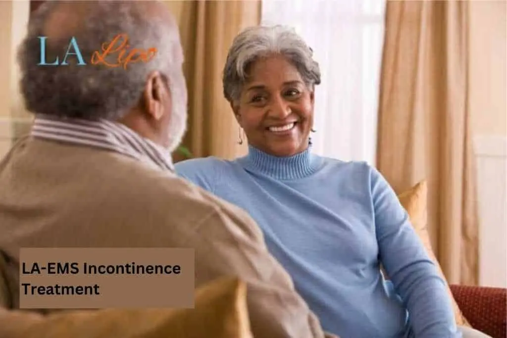 Couple sat smiling at each other - LA-EMS treatment Altrincham