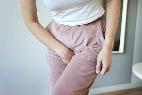 woman running for the toilet because of urinary incontinence Altrincham